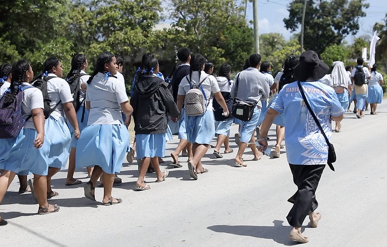 Students matching on a street