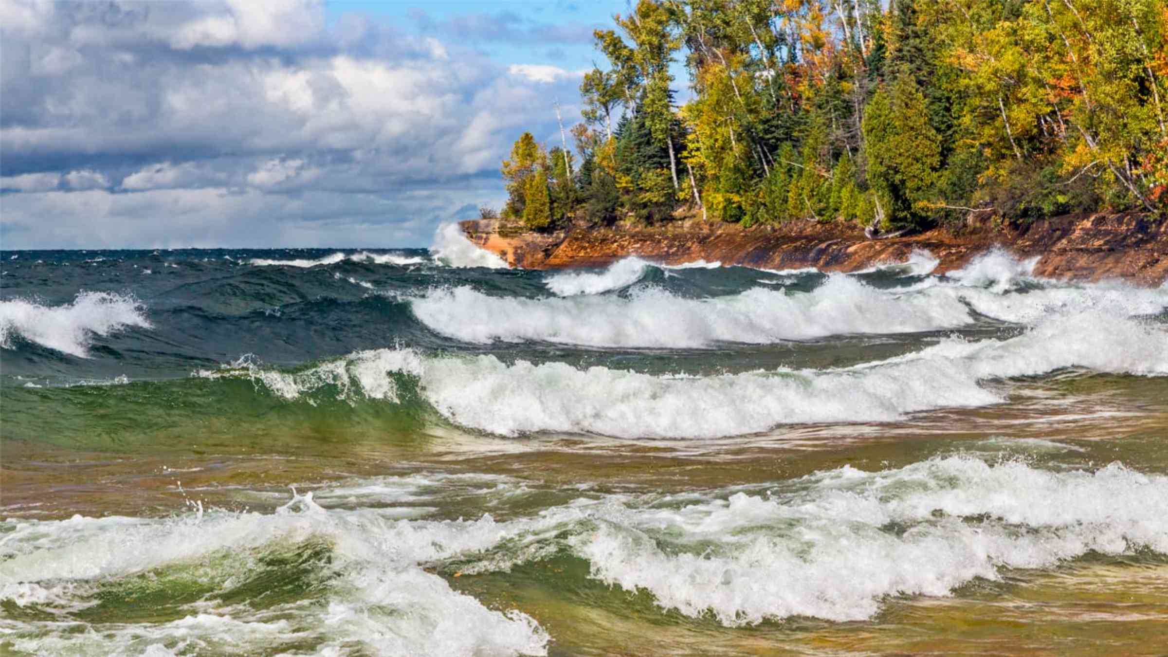 Waves crash on the rocky coast of Lake Superior at Michigan's Pictured Rocks National Lakeshore in autumn (USA)