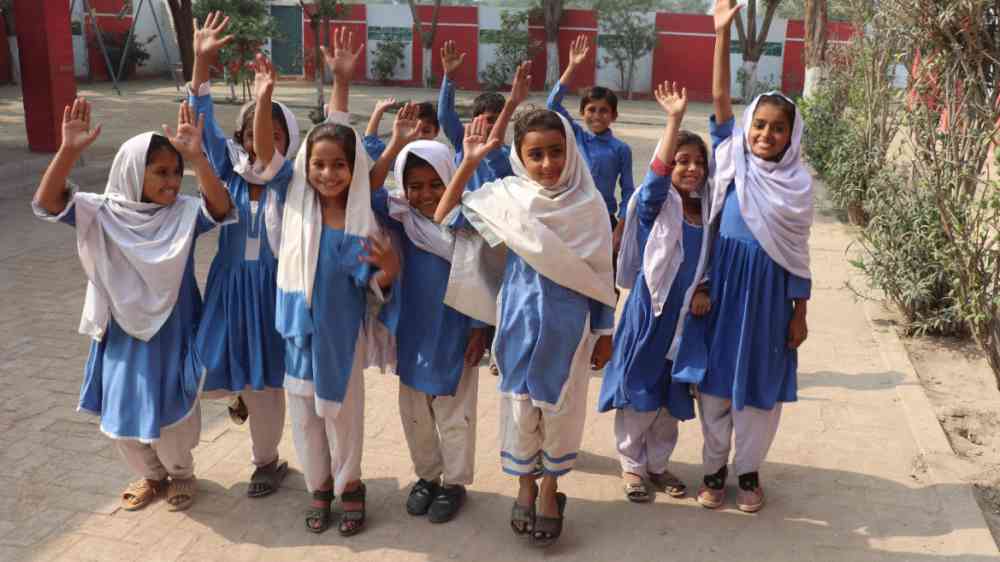 Group of school children happy about news of holidays in Lahore, Pakistan