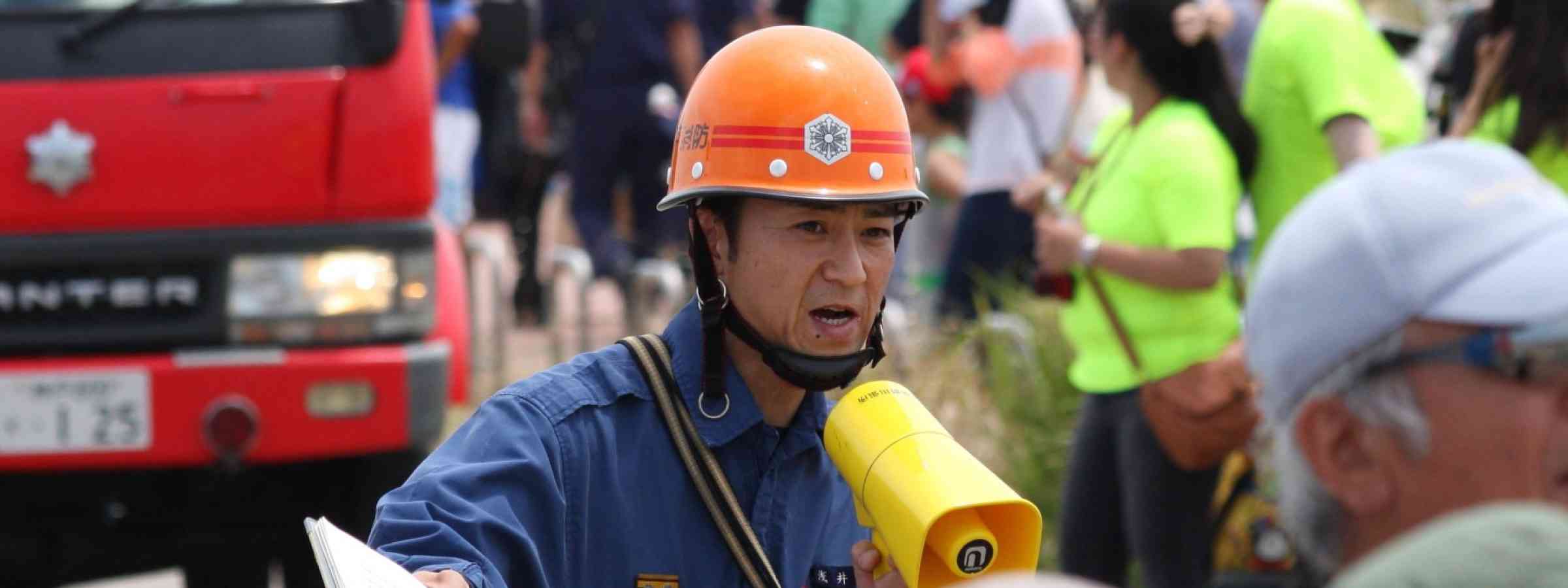 Drill evacuation Japan tsunami During a tsunami evacuation drill held at a beach, firefighters urge people to evacuate from the coast, in Hyogo, Japan, 2013.